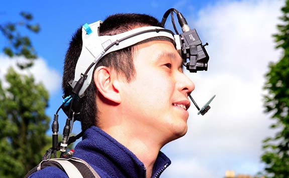 Man wearing research equipment attached to his head.
